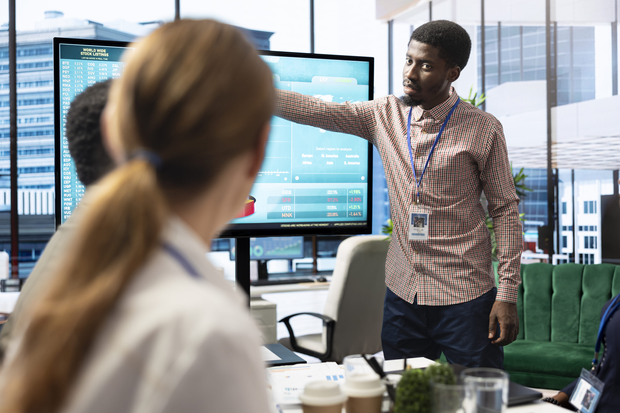 diverse work team discussing digital marketing trends on interactive board